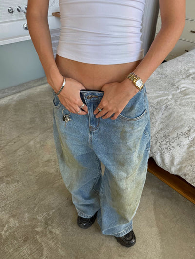 MUD STAINED JEANS - LIGHT BLUE