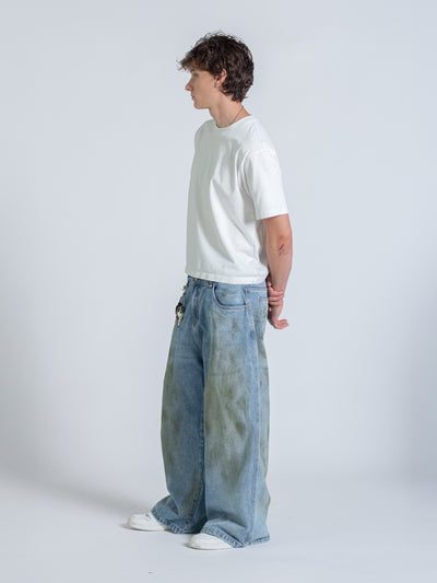 MUD STAINED JEANS - LIGHT BLUE