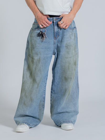 MUD STAINED JEANS - LIGHT BLUE