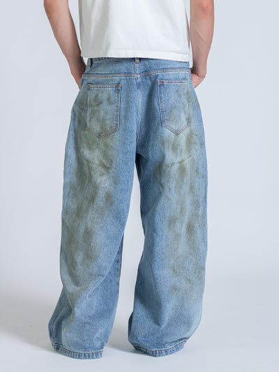 MUD STAINED JEANS - LIGHT BLUE