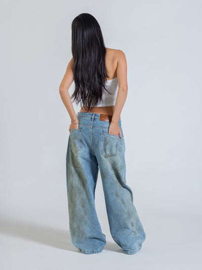 MUD STAINED JEANS - LIGHT BLUE