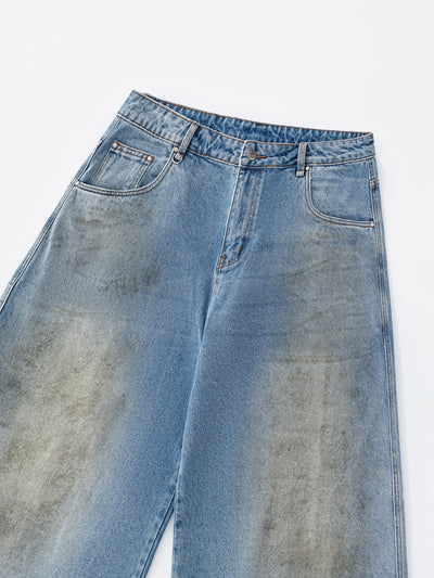 MUD STAINED JEANS - LIGHT BLUE
