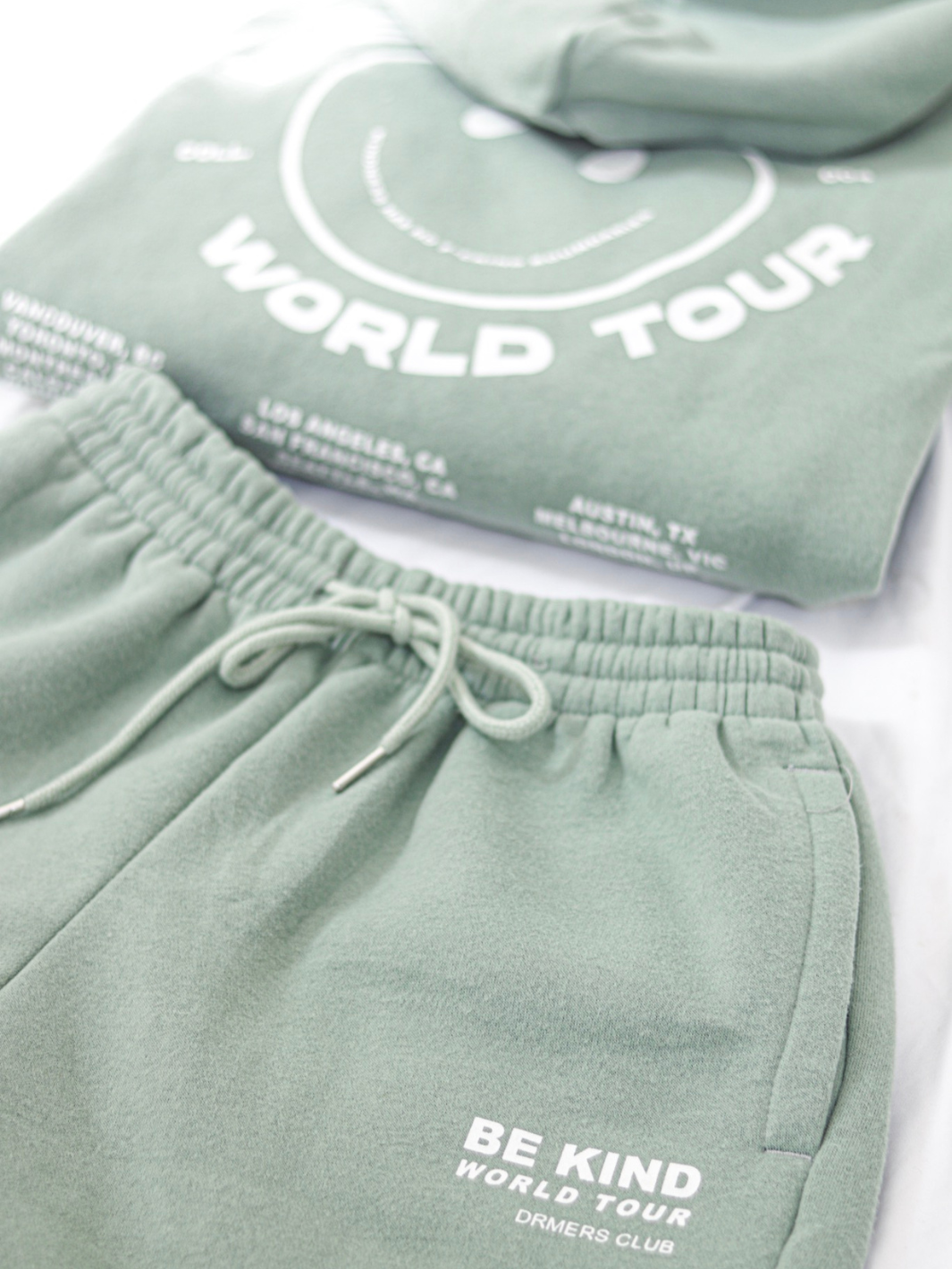 "BE KIND" world tour sweat shorts - sage green